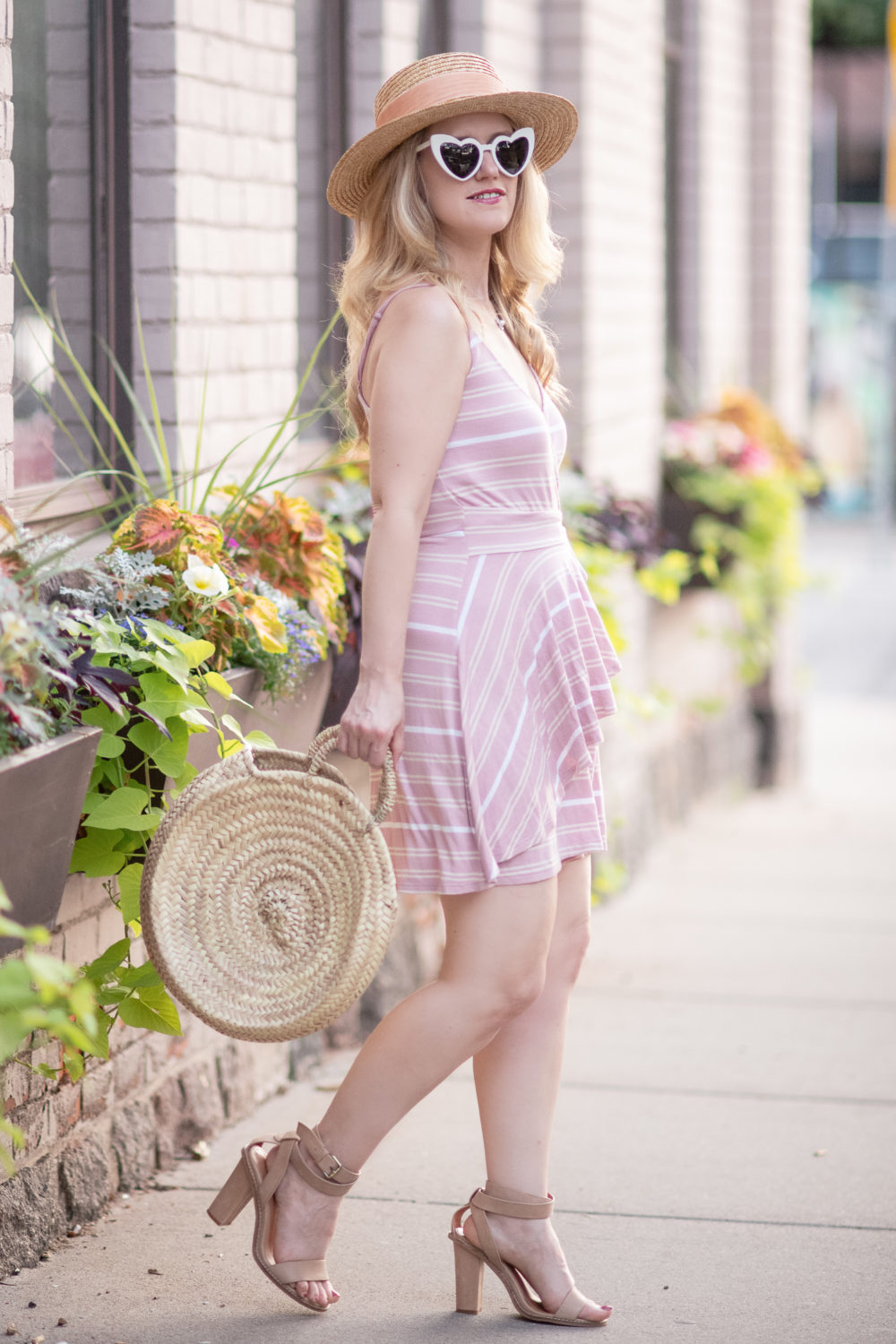 Michigan Petite Fashion and Lifestyle Blog | BP Wrap Romper | Saint Laurent Loulou heart-shaped acetate sunglasses | Caterina Bertini Straw Circle Tote