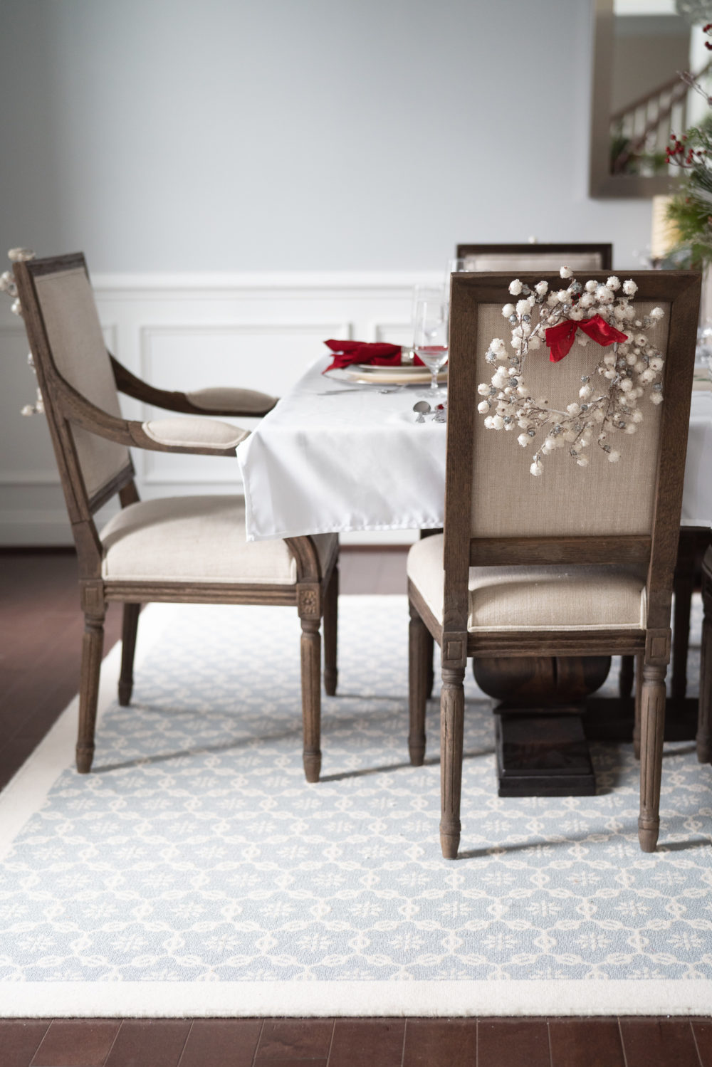 Petite Fashion Blog | Our Home For the Holidays | Eliza J. Velvet Dress | Flocked Christmas Tree | Pottery Barn Plaid Plates | Natural Cedar Garland