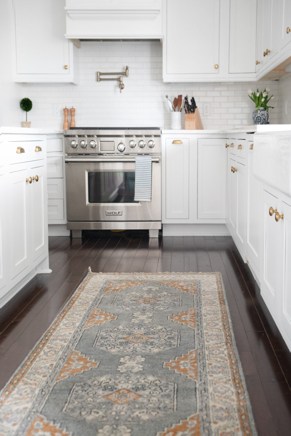 Petite Fashion Blog |White Kitchen | Inset Cabinets | From Overlay to Inset | Caitlin Wilson Rugs