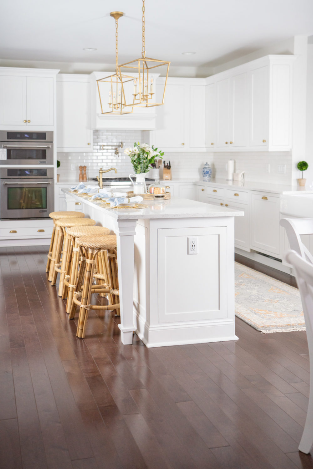 Petite Fashion Blog | Serena and Lily Riviera Counter Stools | White Kitchen | Shaker Cabinets