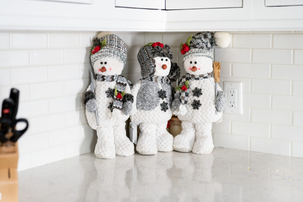 Petite Fashion Blog | Our Home for the Holidays | Christmas Decor | Flocked Christmas Tree | White Kitchen 