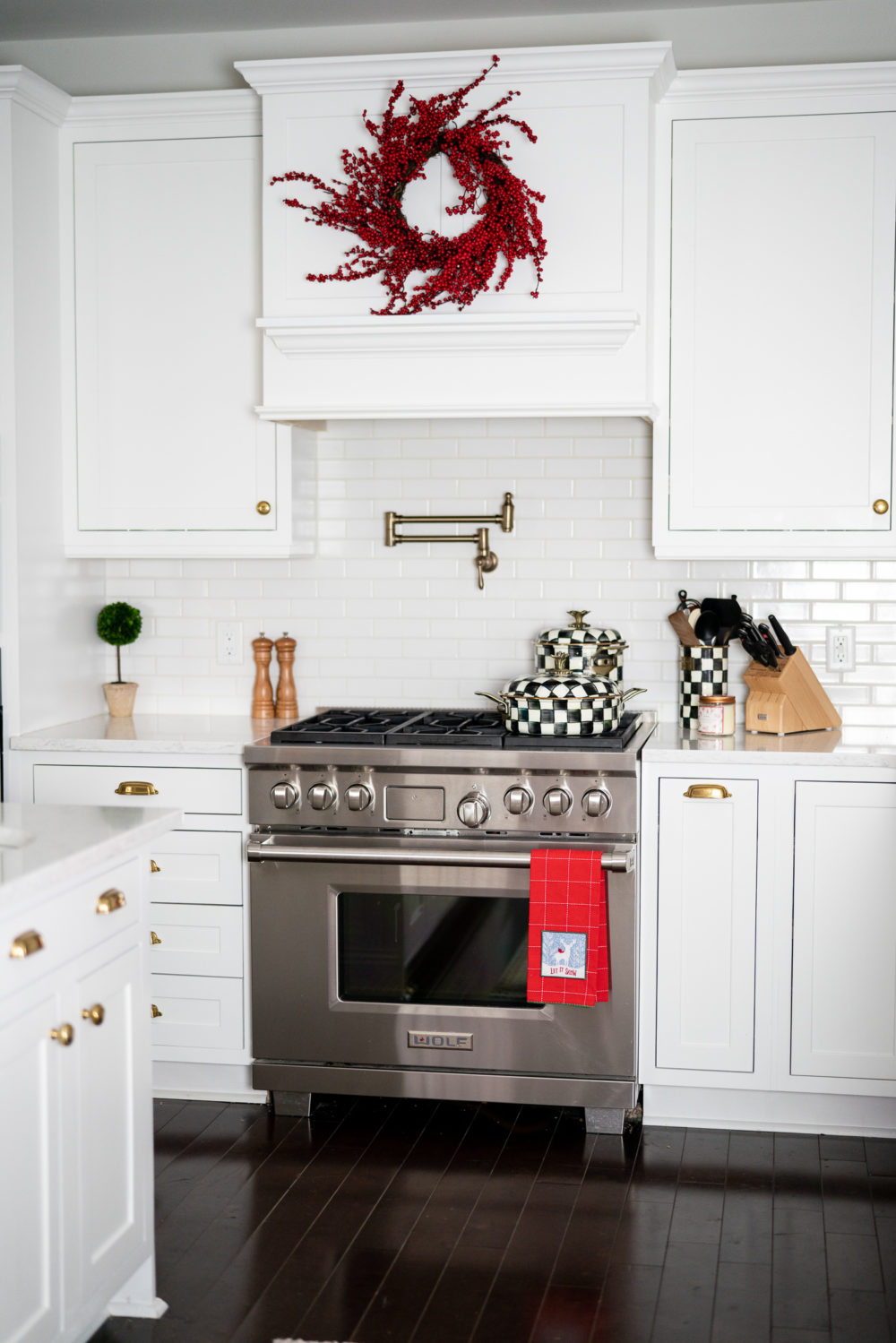 Petite Fashion Blog | Our Home for the Holidays | Christmas Decor | Flocked Christmas Tree | White Kitchen | Mackenzie-Childs Pot